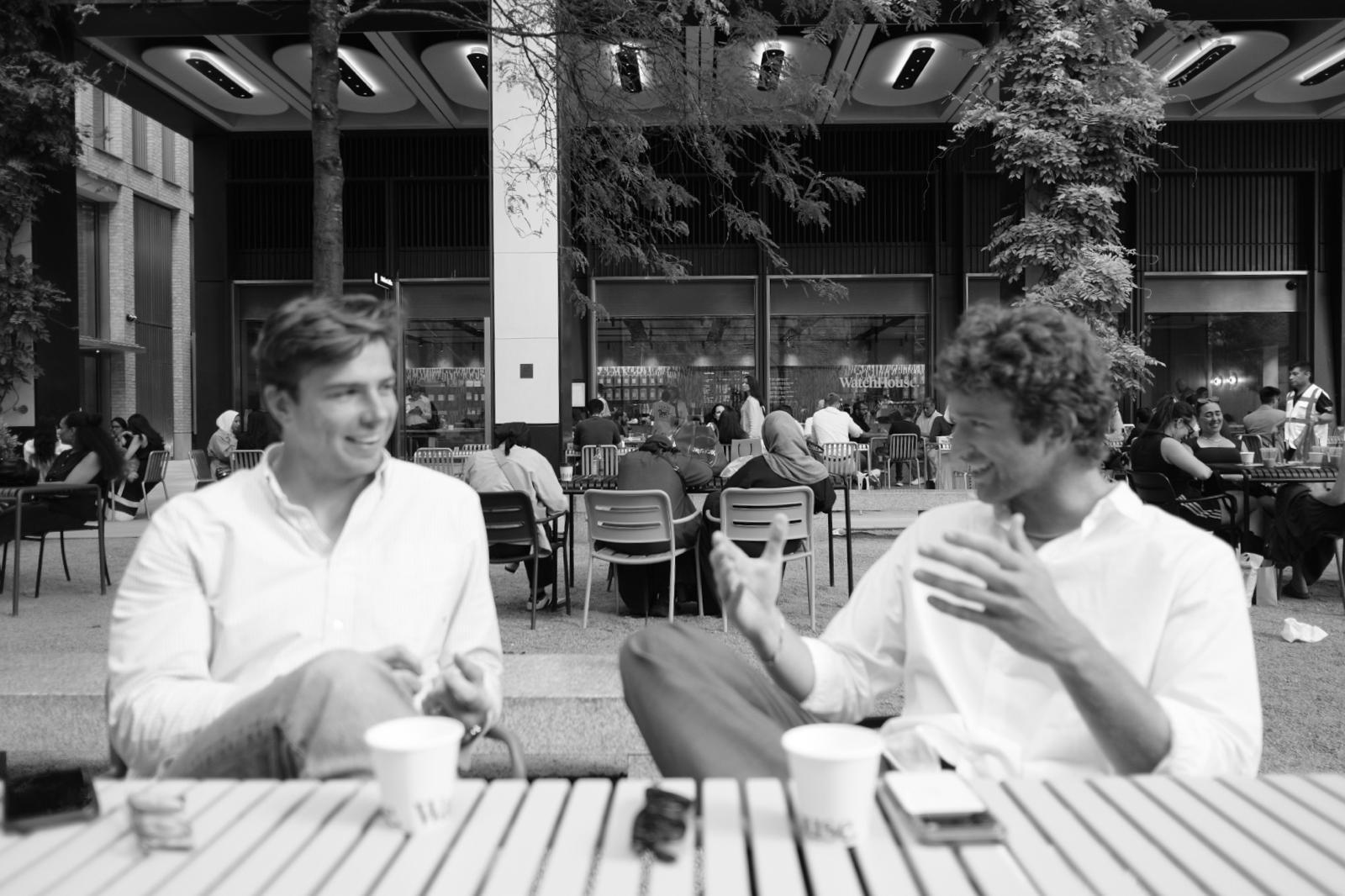 Michael and John Gow talking over coffee